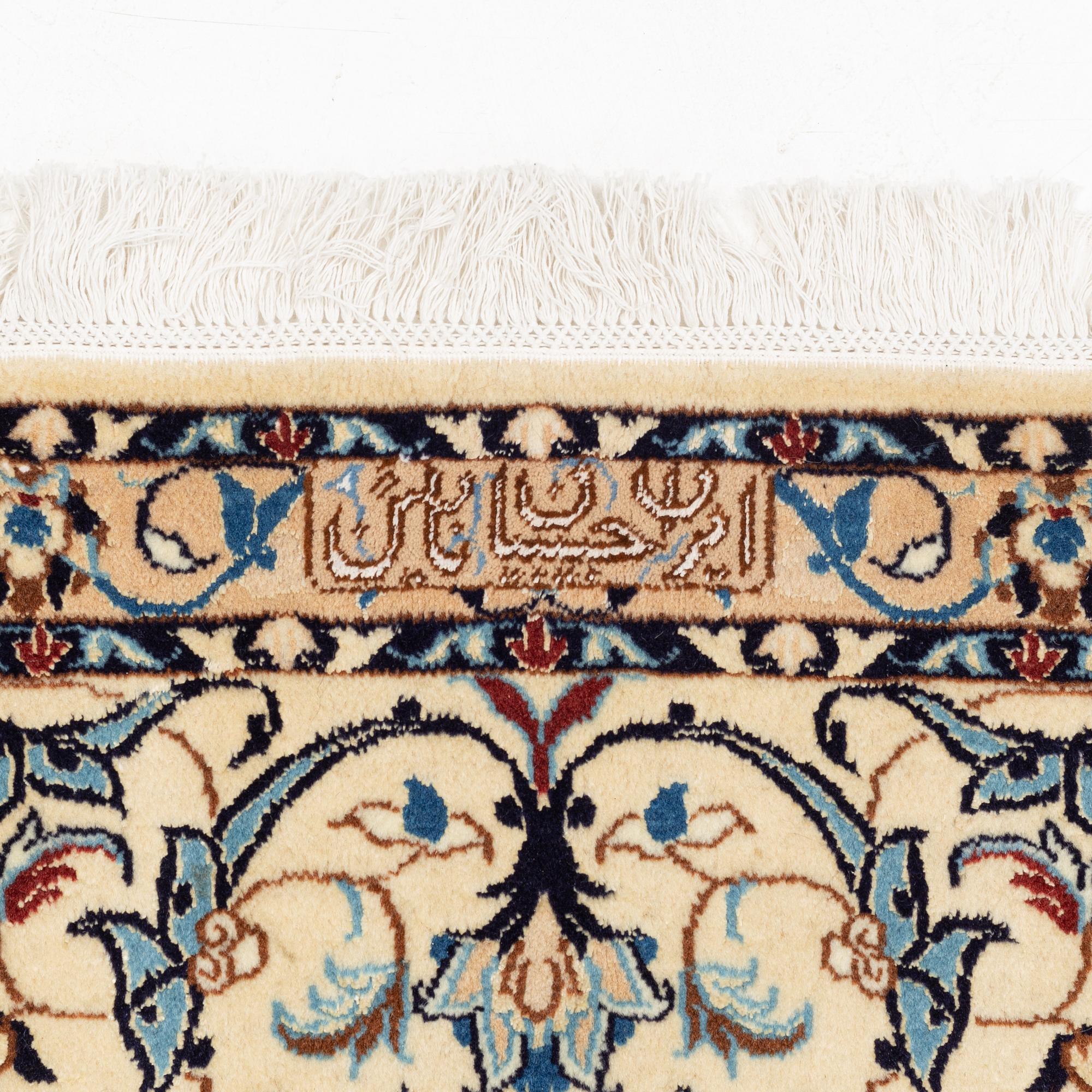 A carpet, Nain, part silk, fine 9 laa, signed, ca 327 x 210 cm.