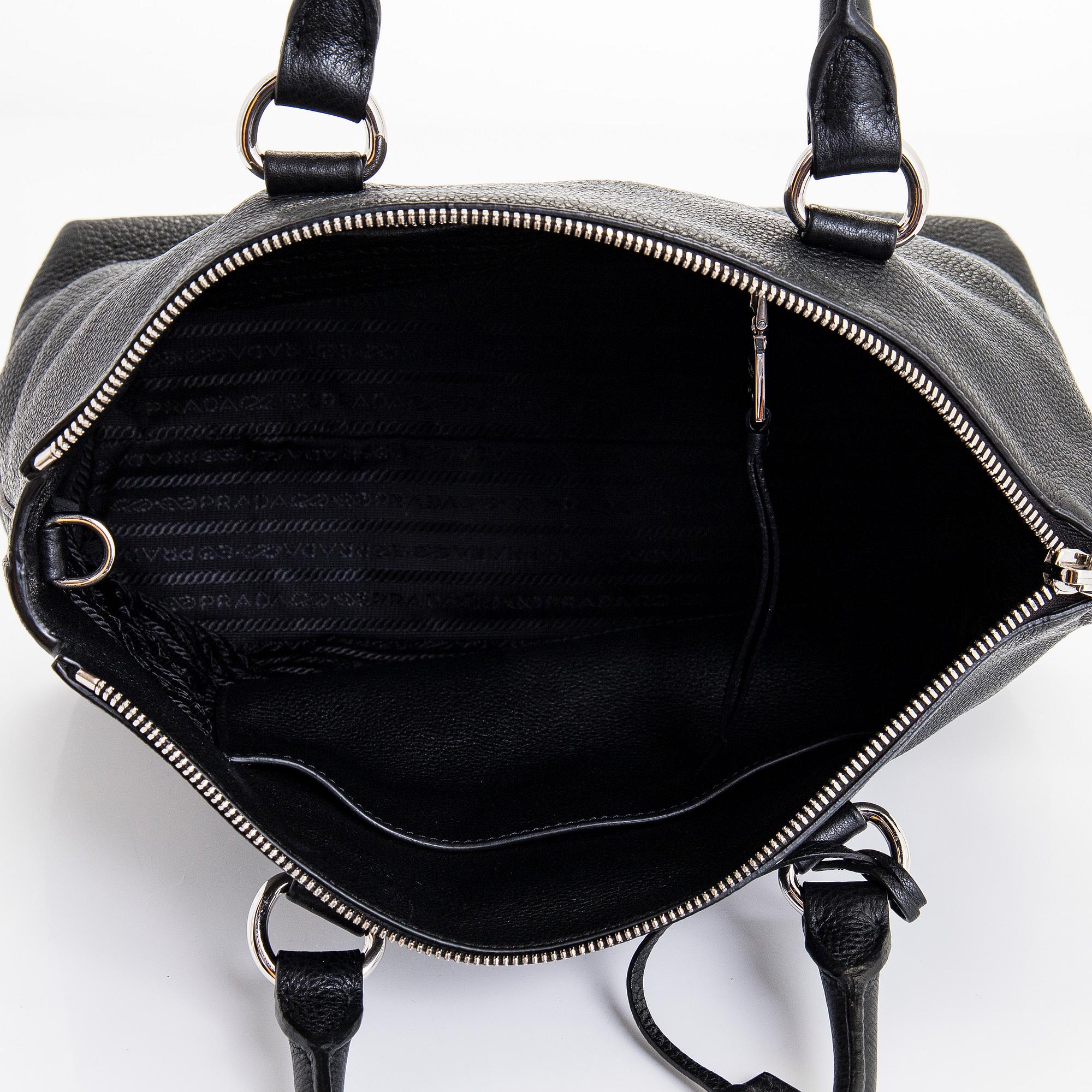 Prada, a leather bag.