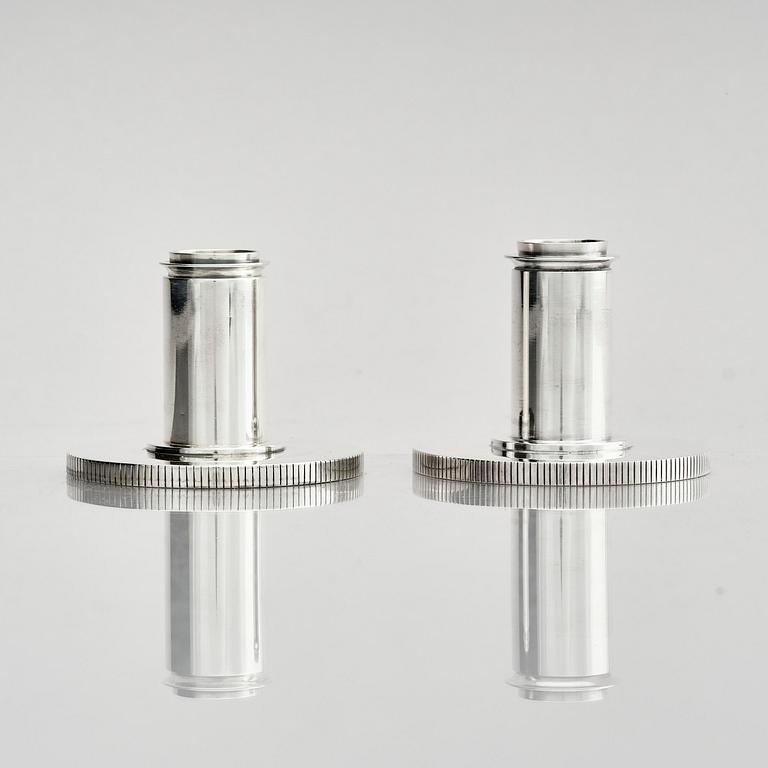 Georg Jensen, a pair of sterling silver candlesticks, design by Sigvard Bernadotte, model no 711A, Copenhagen, Denm after 1945.