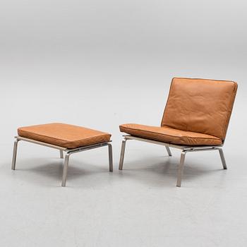 A 21st century easy chair and foot stool by Norr 11, Denmark.