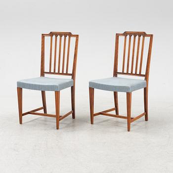 A mahogany table and 12 chairs, first half 20th Century.