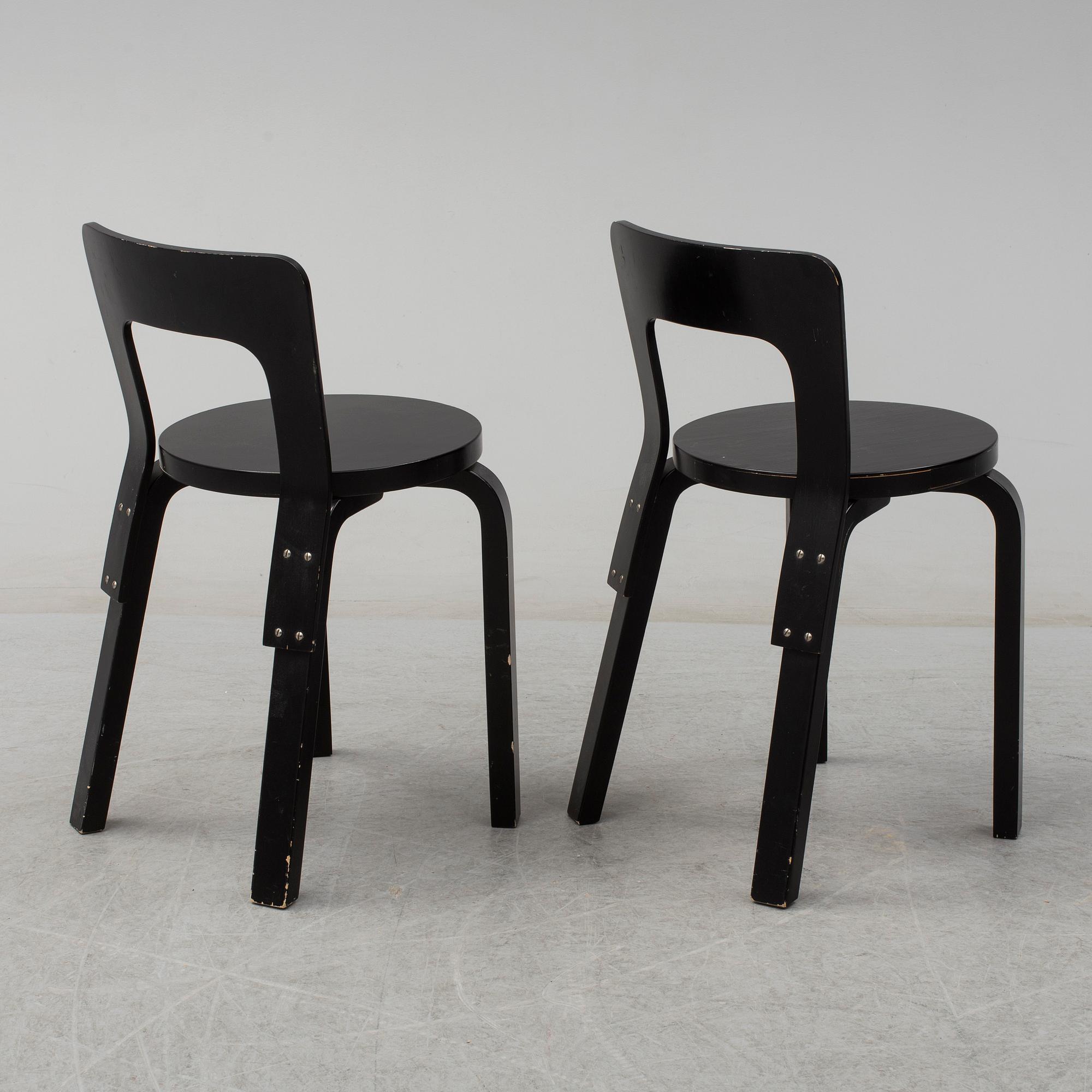 ALVAR AALTO, a pair of painted model 65 chairs from Artek, Finland.