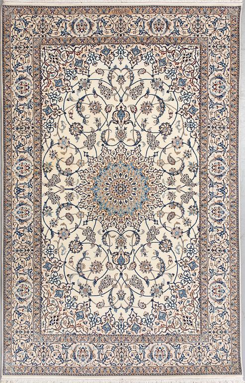 A Nain Habibian rug, part silk. Around 210 x 133 cm.