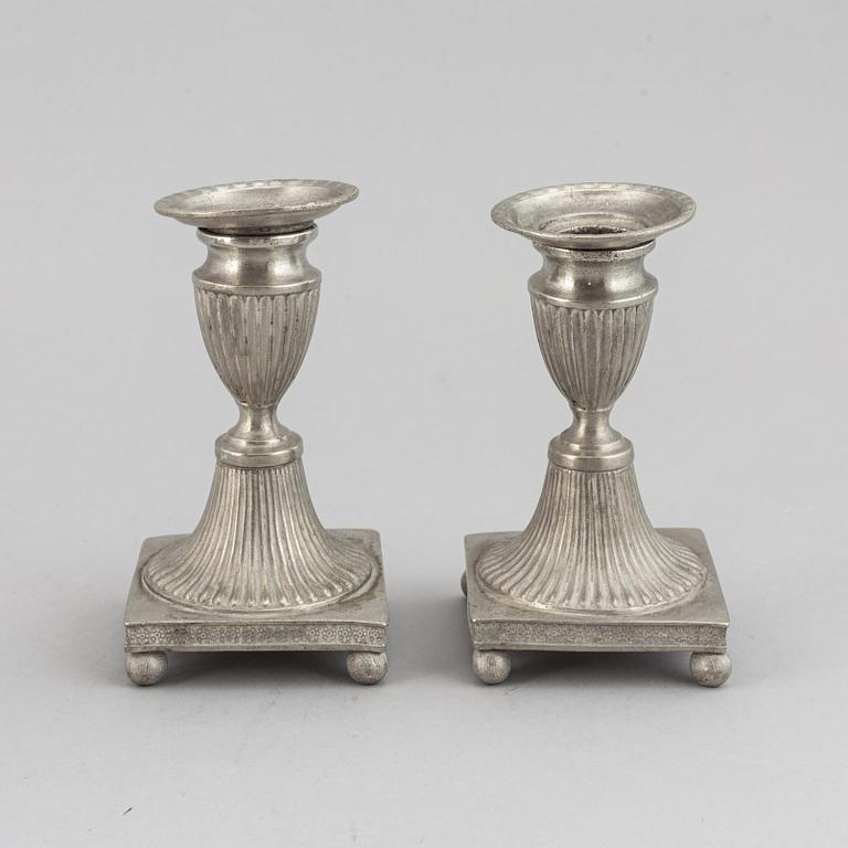 Two pairs of Swedish pewter candlesticks by Erik Wikgren, possibly and Nils Silov, first half of the 19th century.