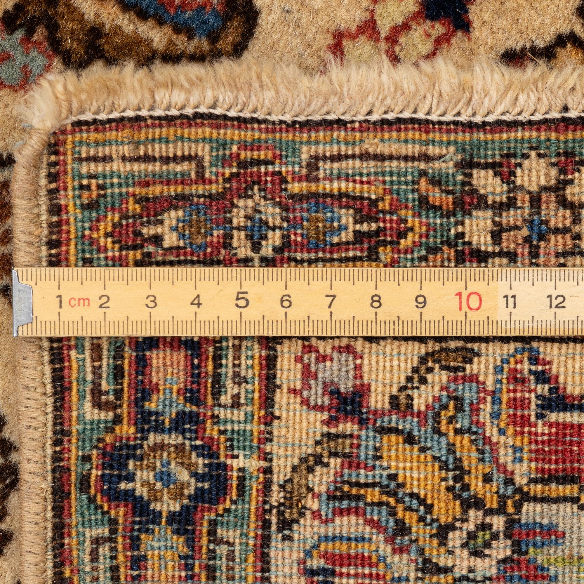 A pair of semi antique Tabriz rugs, Northwest Persia, c. 210 x 136 cm.