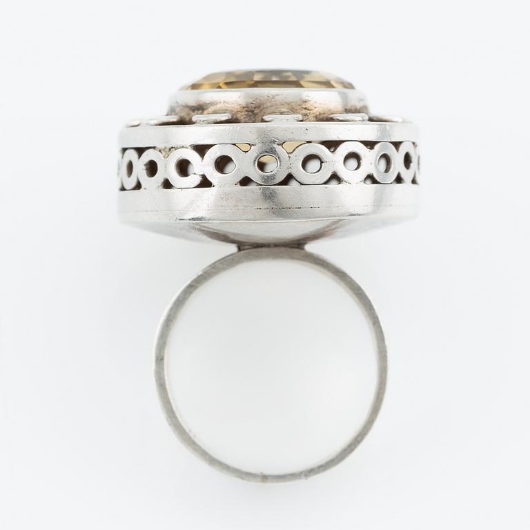 Silver ring with gold stone, signed Ulla Holm.