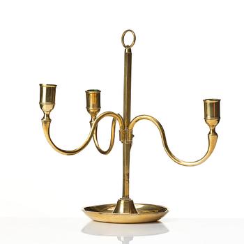 A Gustavian brass three light candelstick.