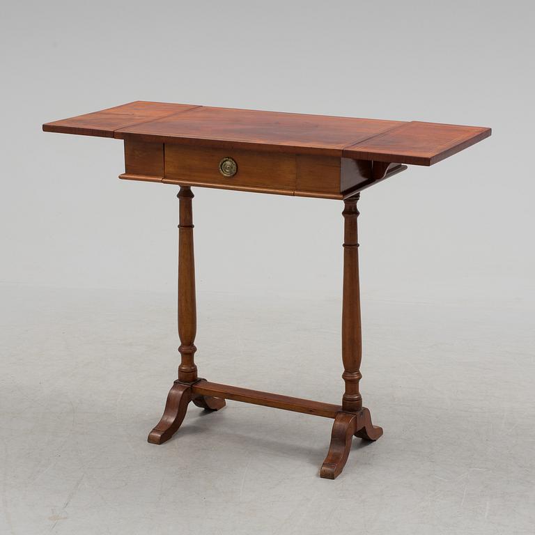 A Swedish first half of the century Karl Johan style mahogany veneered table.