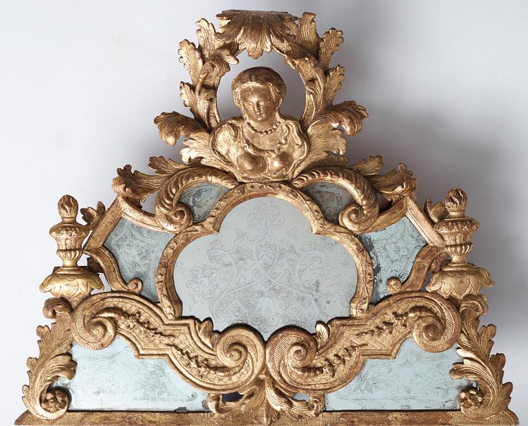 A Baroque mirror, circa 1700.