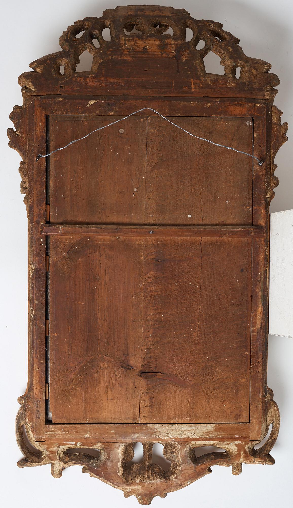 A Swedish Rococo two-light girandole mirror by Johan Åkerblad, dated 1769.