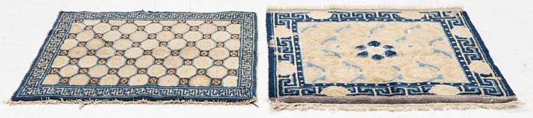 Two antique Ningxia meditation rugs, Qing dynasty, 19th century. c. 67 x 72 and 71 x 73 cm.