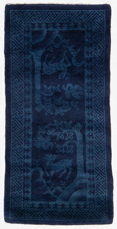 An antique Baotou rug, North China, c 157 x 75 cm.