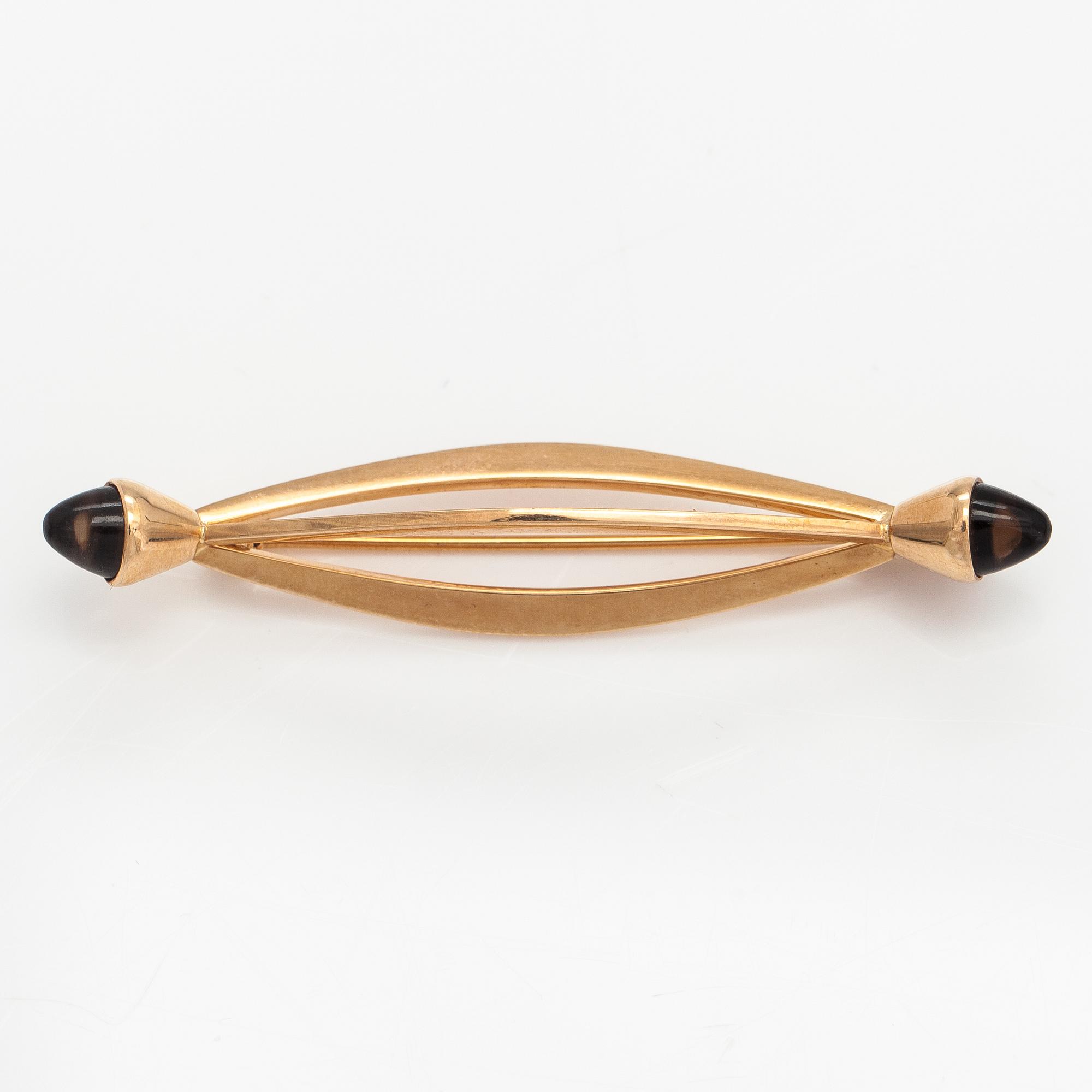 Elis Kauppi, A 14K gold brooch with smoky quartzes. Kupittaan kulta, Turku 1961.