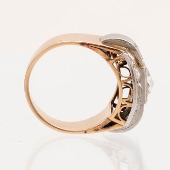 An 18K white and red gold ring set with rose cut diamonds.