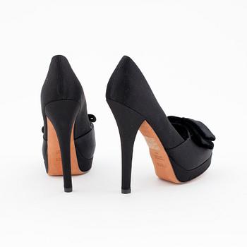 FENDI, a pair of black satin pumps.