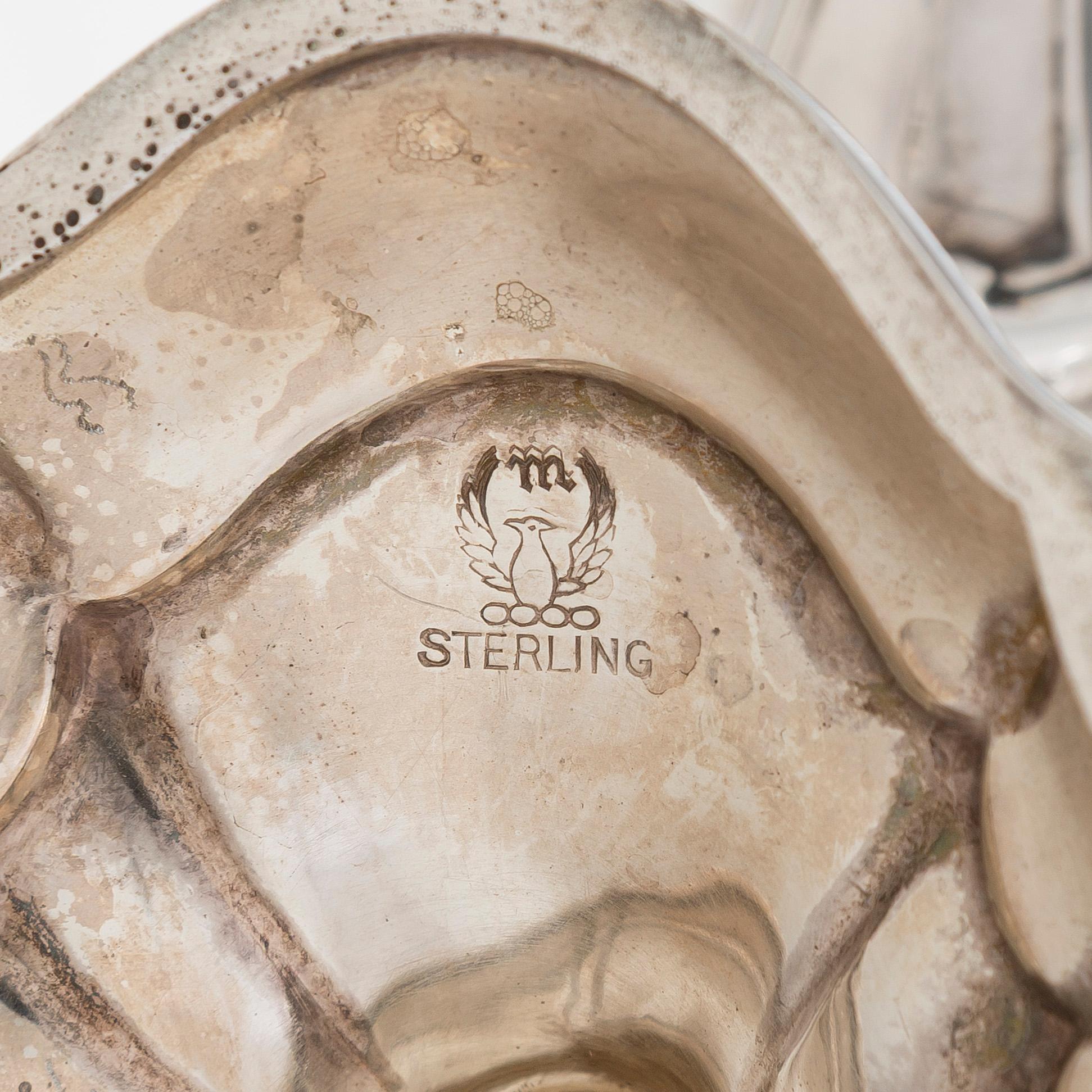 A five-piece sterling silver coffee and tea service, and 12 spoons, USA, first quarter of the 20th century.