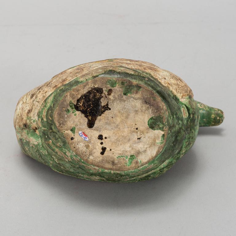 A green and yellow glazed bisquit duckshaped ewer, Ming dynasty (1368-1644).