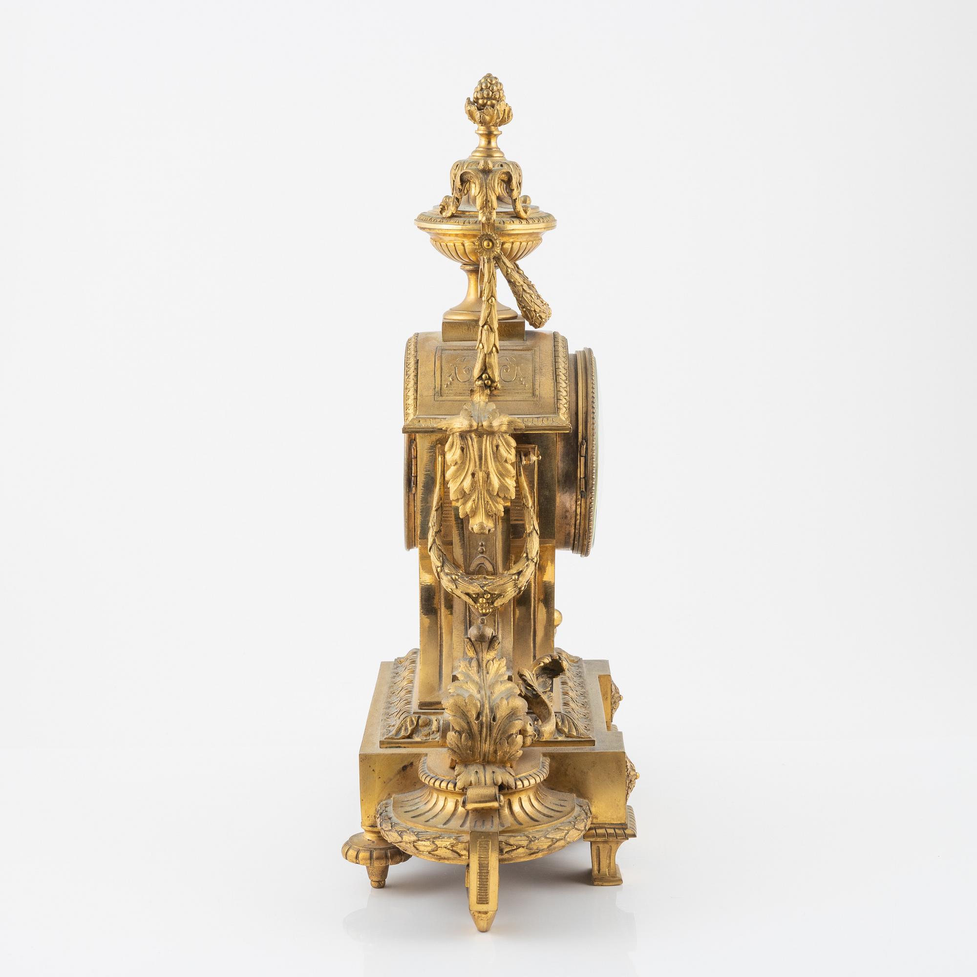 A Louis XVI-style gilt bronze mantel clock, 19th Century.