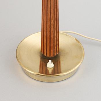 A brass and oak table light by Hans Bergström for ASEA, mid 20th Century.