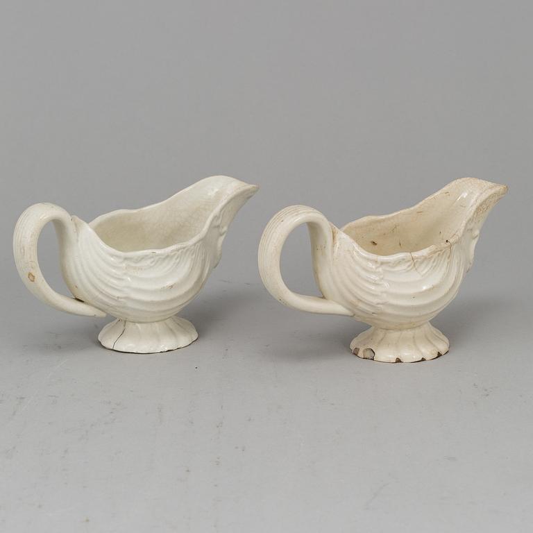 A creame weare buttertureen with cover, a cake mould and a pair of sauce boats, 18/19th Century, part Rörstrand.