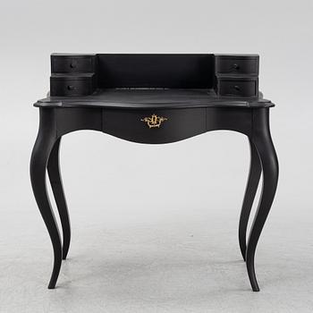 A painted rococo style writing desk, from around the year 1900.