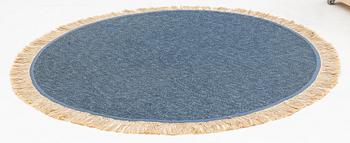 A rug, diameter circa 188 cm.