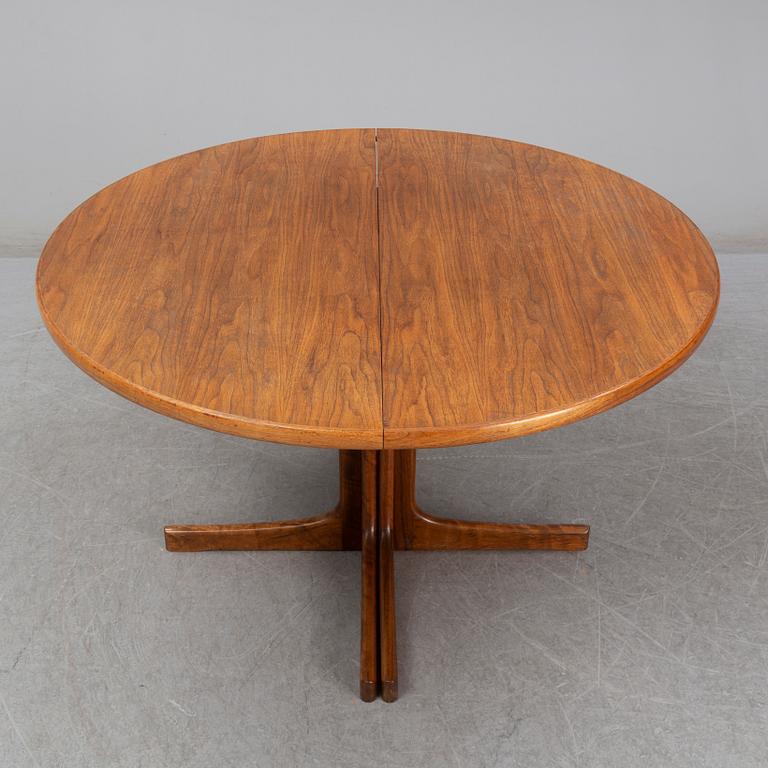 A walnut vereered dining table, mid 20th Century.