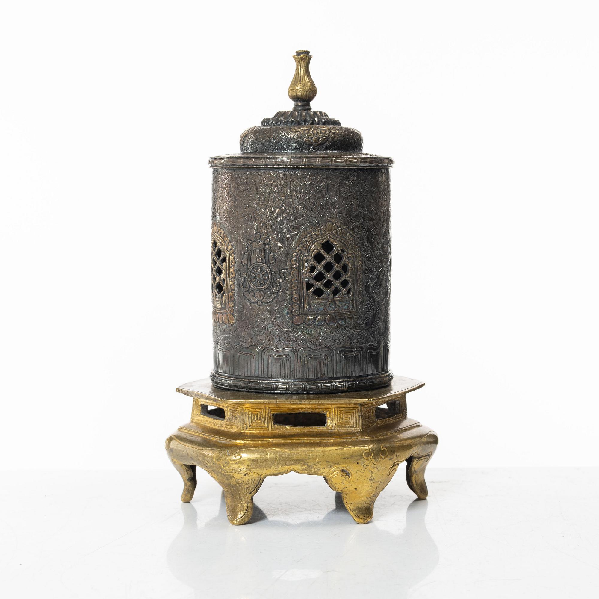 A silvered brass prayer container, Tibet, 20th century.