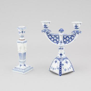 A porcelain candelabra and a candlestick from Royal Copenhagen, model "Musselmalet", 20th century.