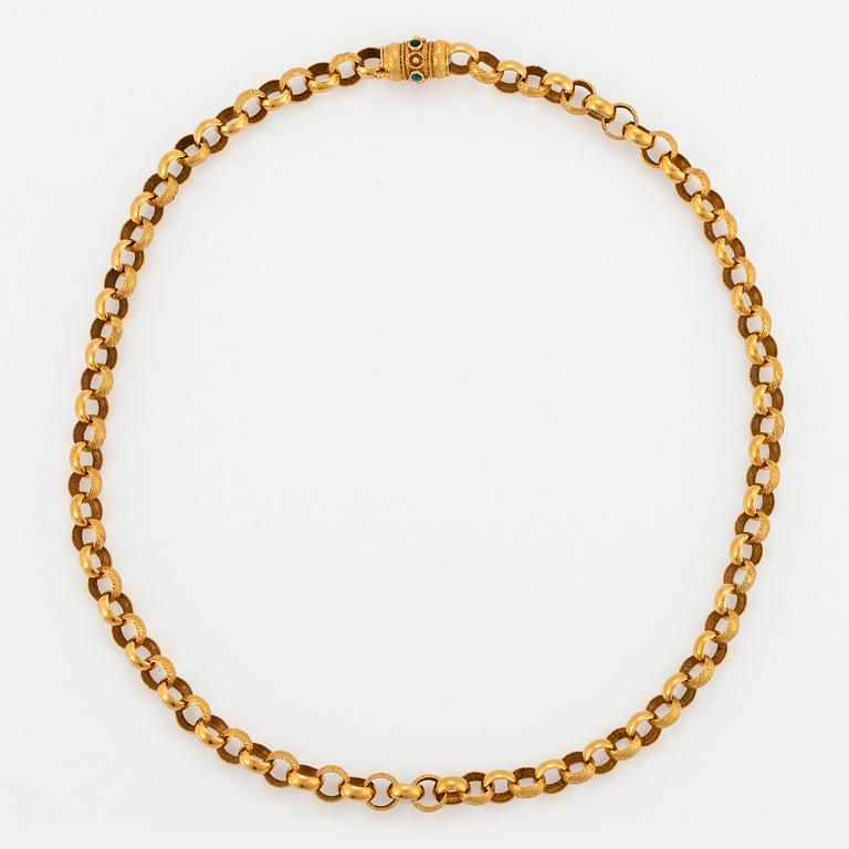 Collier 18K guld med gröna stenar.