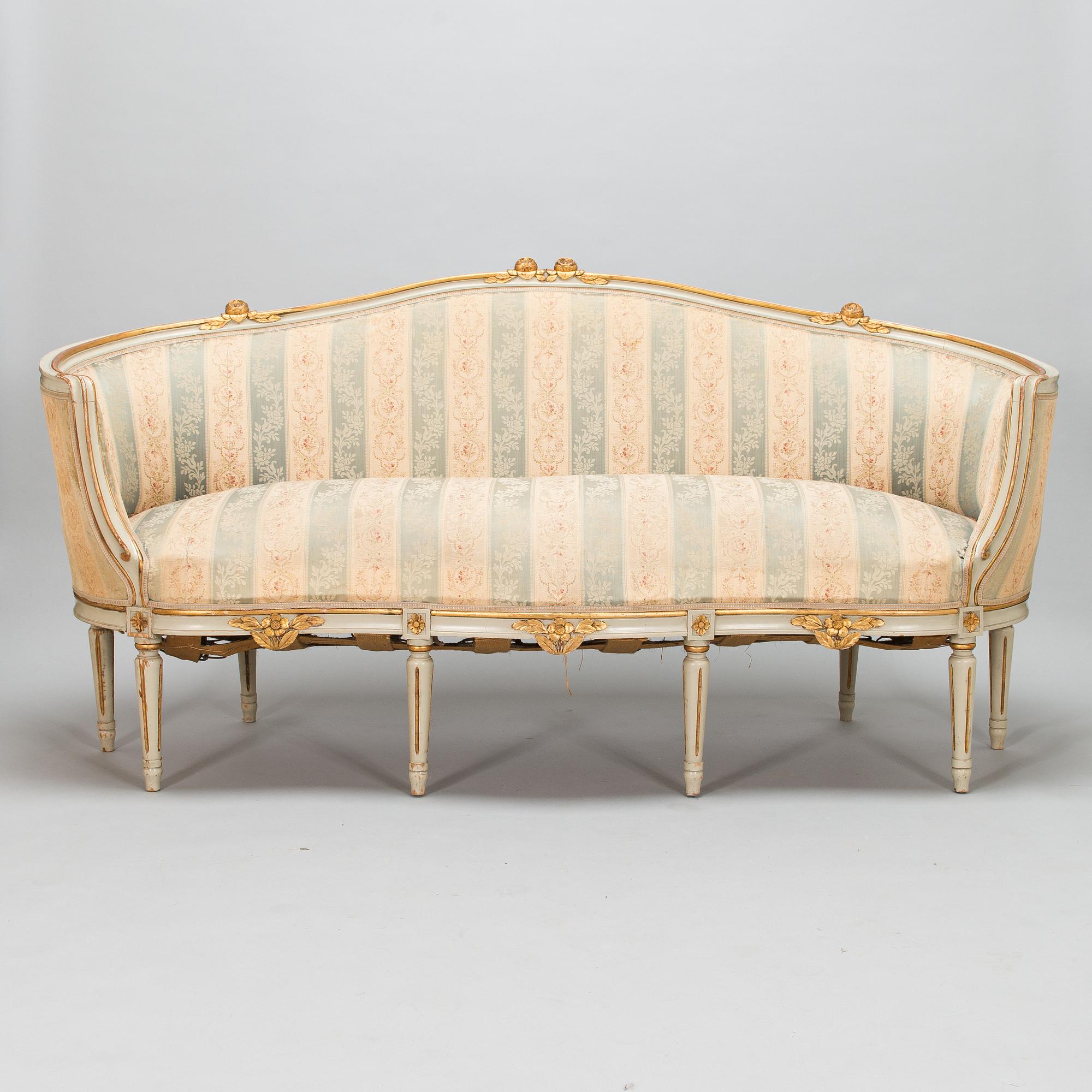 A Gustavian style sofa and table from early 20th century.