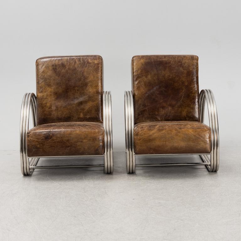 A pair of 'Hudson Street' lounge chairs from Ralph Lauren home.
