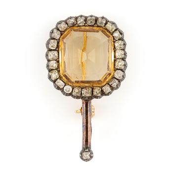 547. A brooch/pendant, gold and silver with topaz and old-cut diamonds, circa 1900.