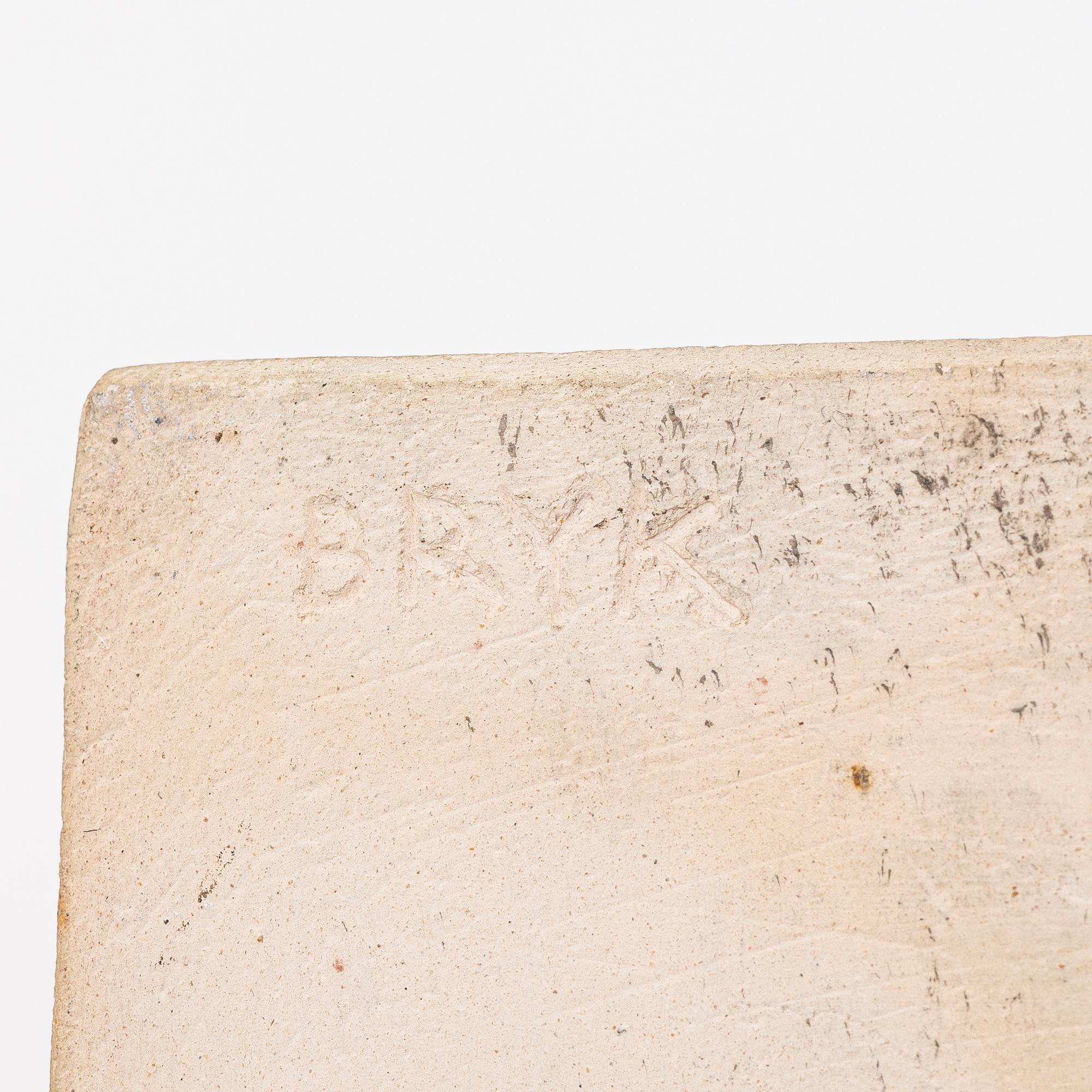 Rut Bryk, plates, as well as plate/wall relief, stoneware.