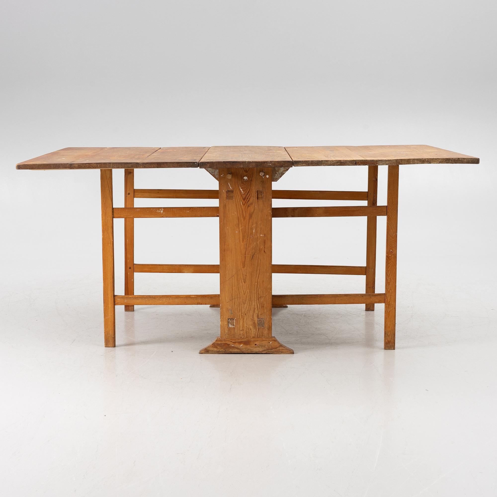 A drop-leaf table, 19th Century.