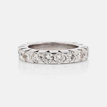 An eternity ring, set with brilliant-cut diamonds. Total carat weight 3.24 cts.