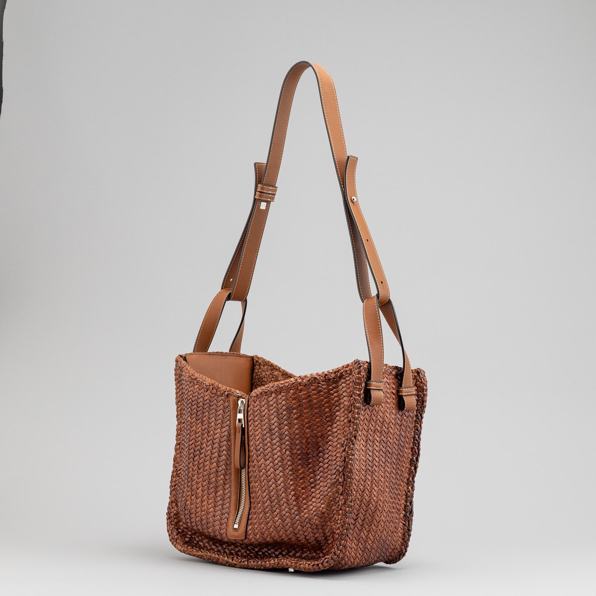 Loewe, a brown woven leather handbag.