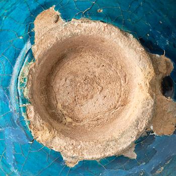 A turquoise Keshan pottery vase, central Persia, 13th century.