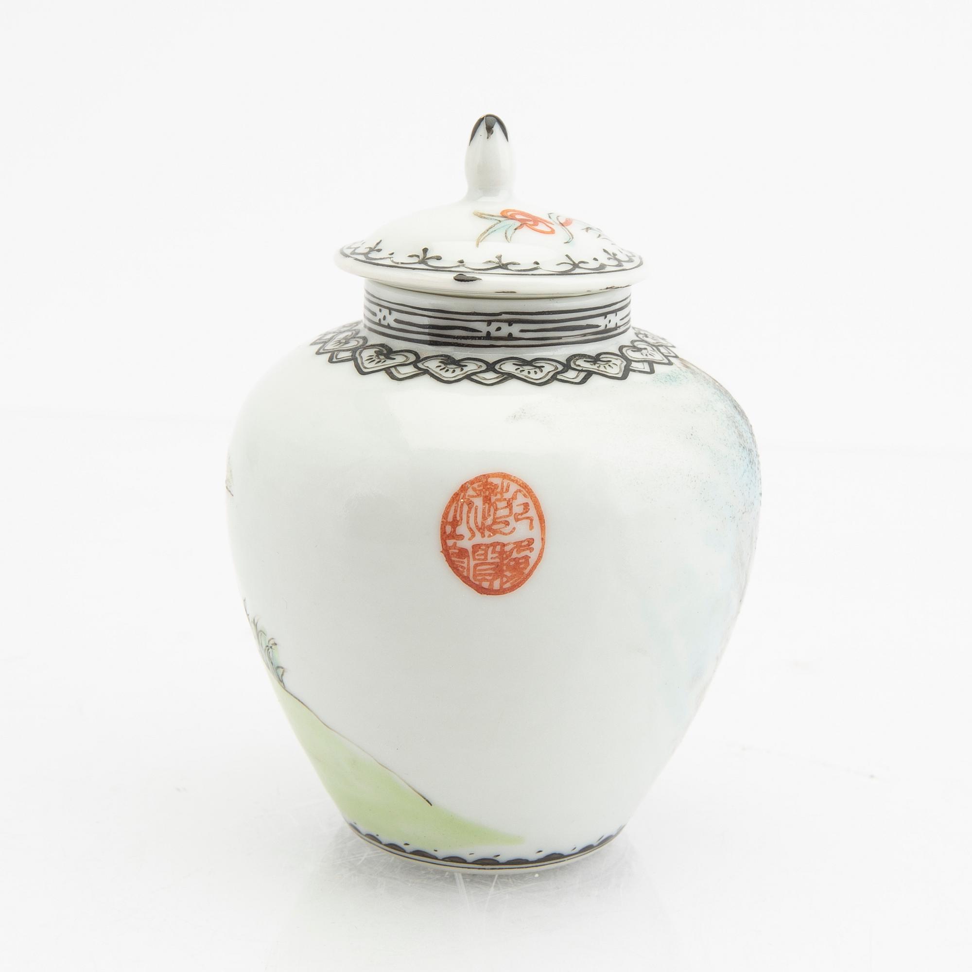 A Chinese 20th century Yixing ware tea service and a porcelain tea caddie.