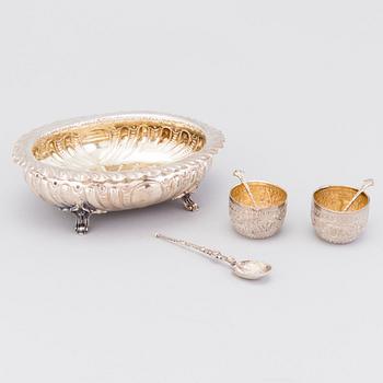 A pair of parcel-gilt salt cellars with salt spoons, a sterling silver spoon and a bowl, London and Sheffield 1883-1902.