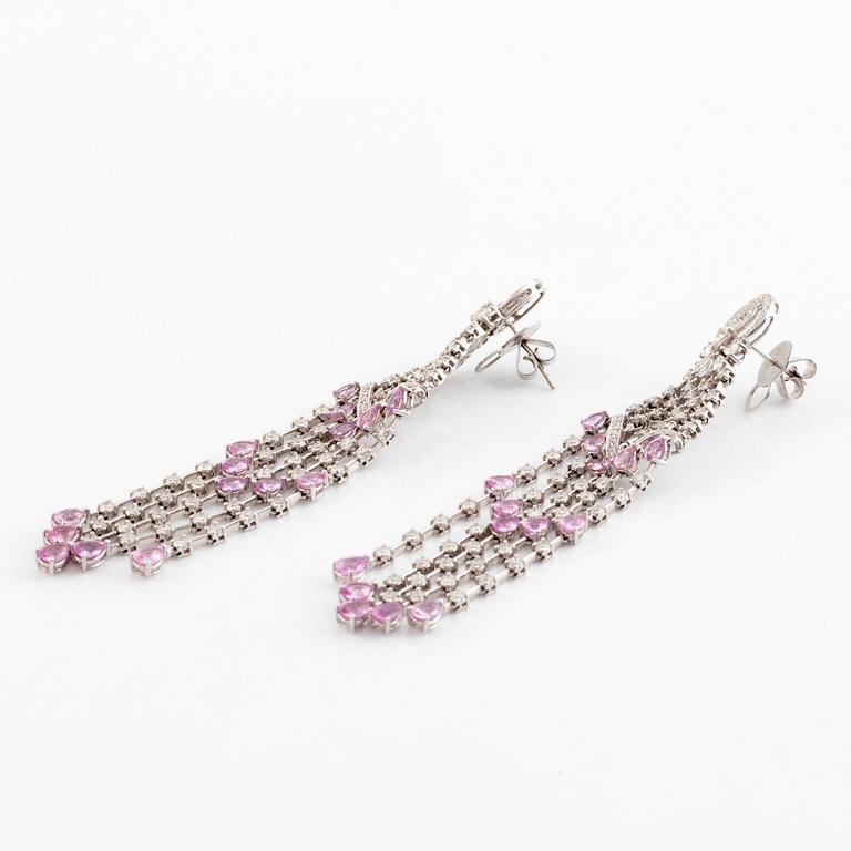 A pair of 18K white gold earrings set with faceted pink sapphires, drop- and round brilliant-cut diamonds.