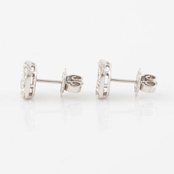 A pair of earrings in 18K white gold set with round brilliant-cut diamonds.