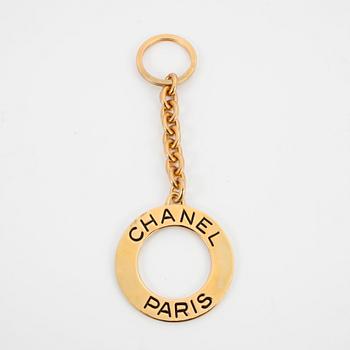 CHANEL, a golden key-ring.