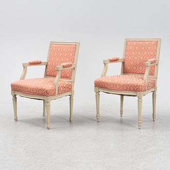 A pair of Gustavian style armchairs, circa 1900.