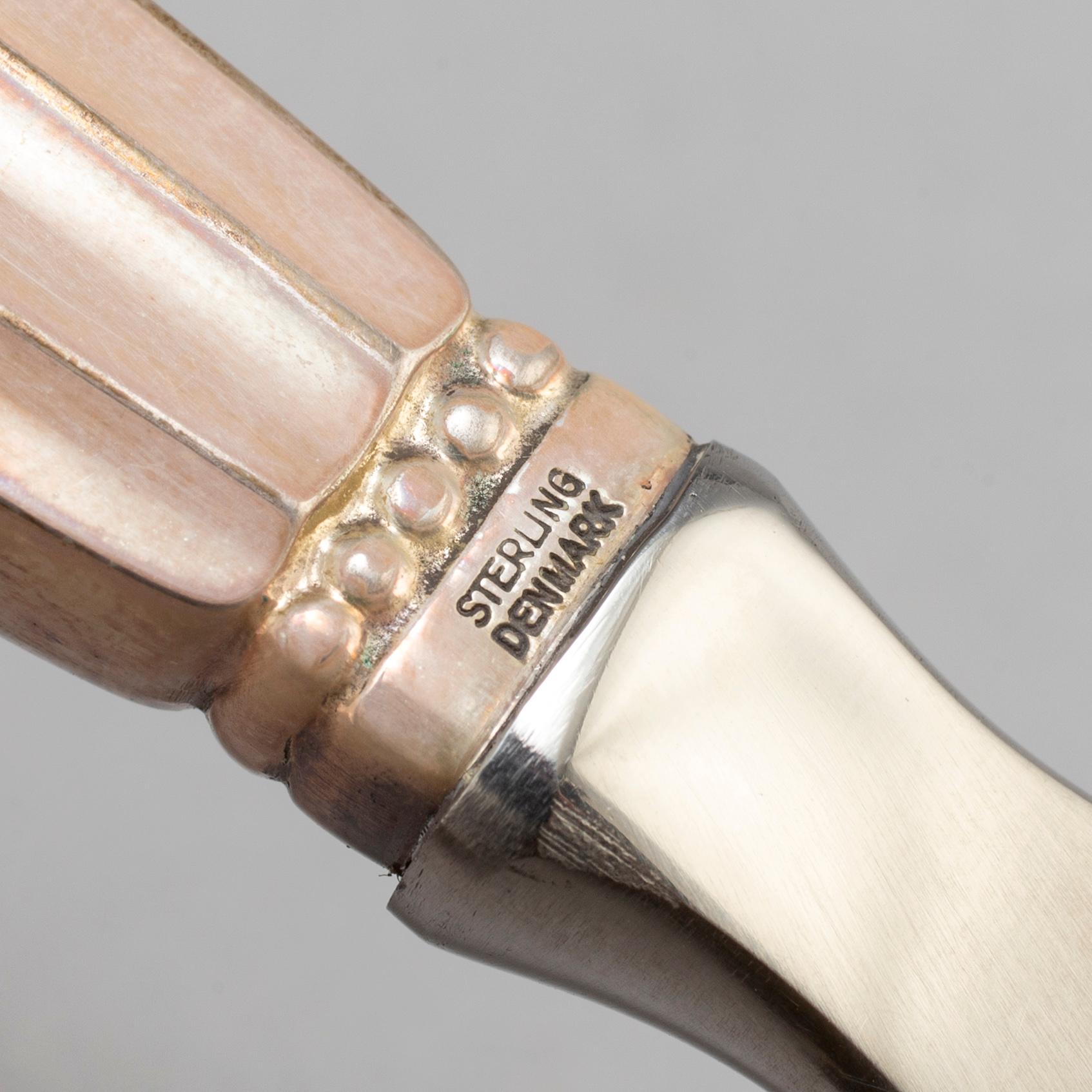 A Danish 20th century set of three Georg Jensen silver openers.