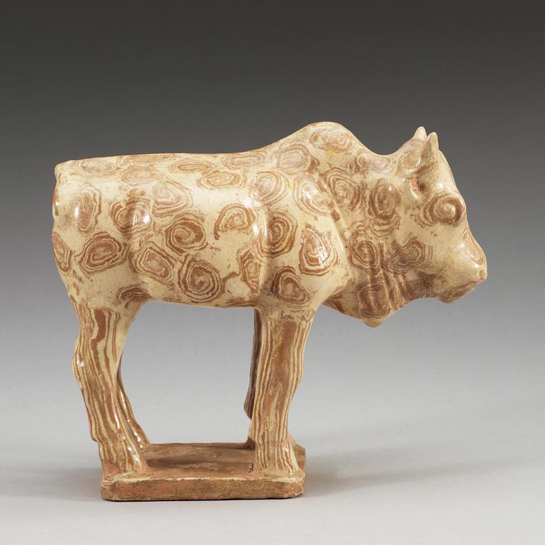 A glazed pottery figure of an ox, Tang dynasty (618-907).