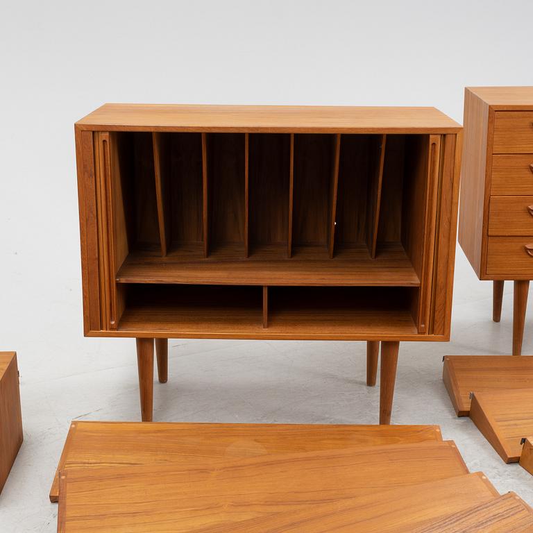 A teak and teak veneered shelf system, mid 20th century.