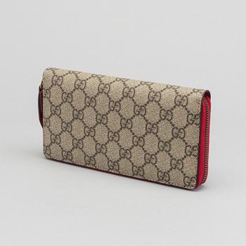 GUCCI plånbok.  "GG Supreme zip around wallet with cherries".
