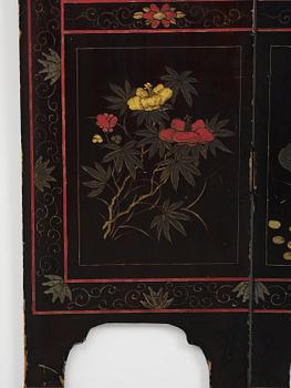 A Chinese four panel lacquer folding screen, first part of the 20th century.