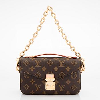 Louis Vuitton, a Monogram Canvas "Pochette Métis East West" bag.